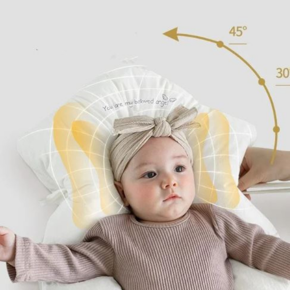 Ergonomisk babykudde i neutrala toner