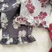 Lunea Kids Flora Volangbyxdress Flicka – Sommarjumpsuit i bomull – Blommönster – Volanger – 0–6 år – Luftiga barnkläder