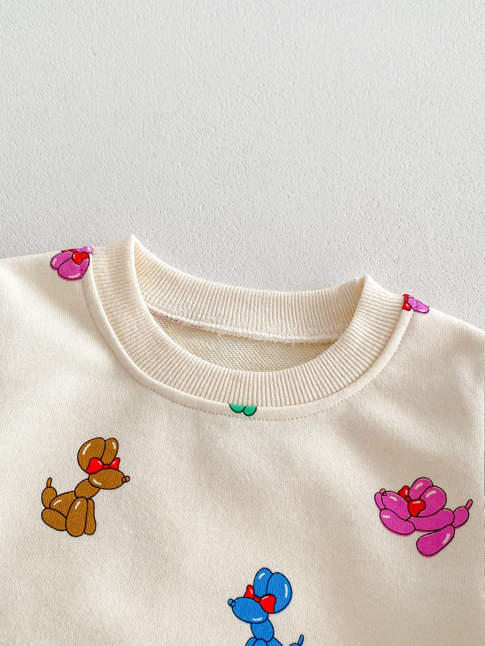 Träningsdräkt med ballonghundar – BouncyBuddies Unisex, Beige, Bomull, Storlek 0–4 år