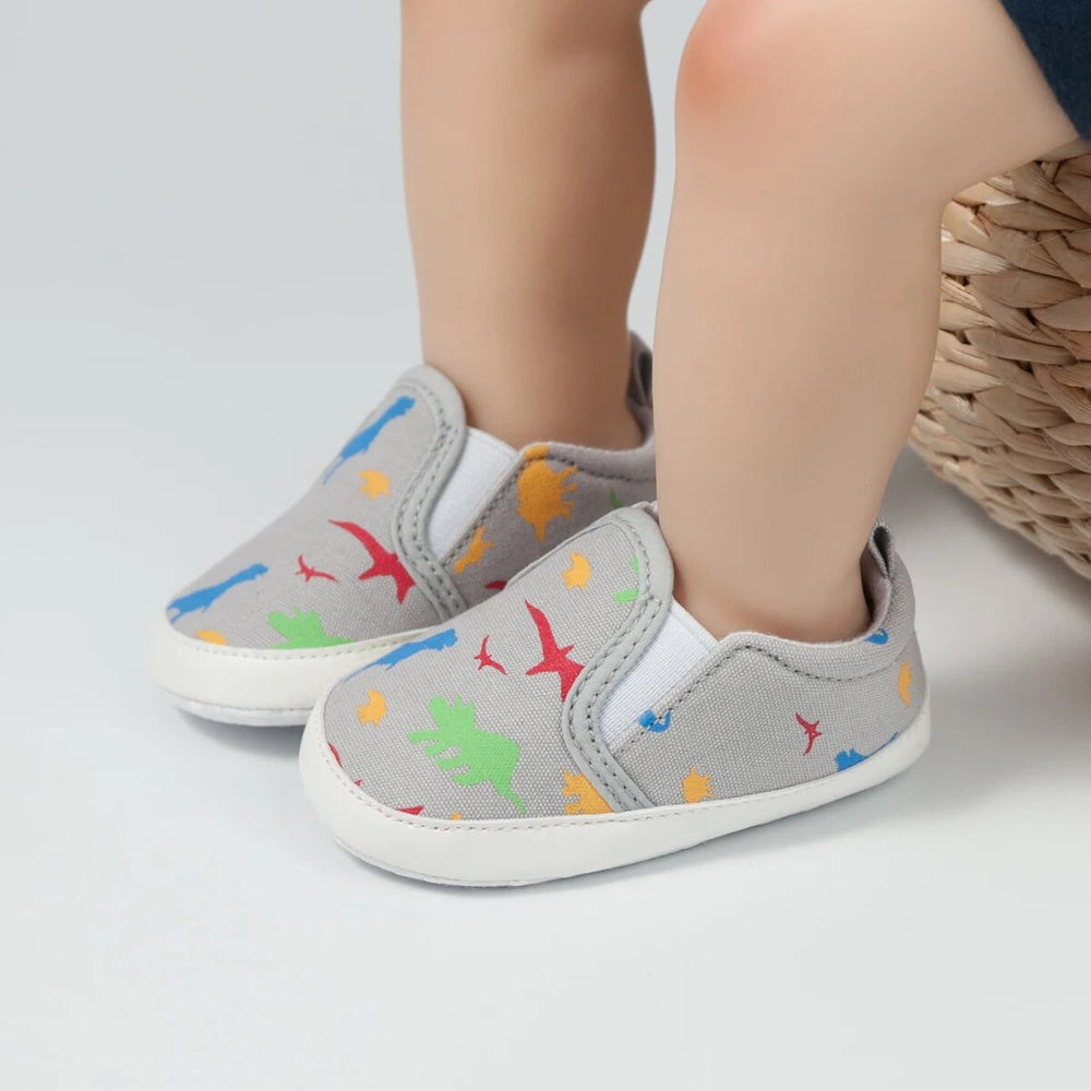 Slip-on-babyskor med halkfri sula – Minoe instegssneakers med dinosaurie och enhörning (0–18 månader)