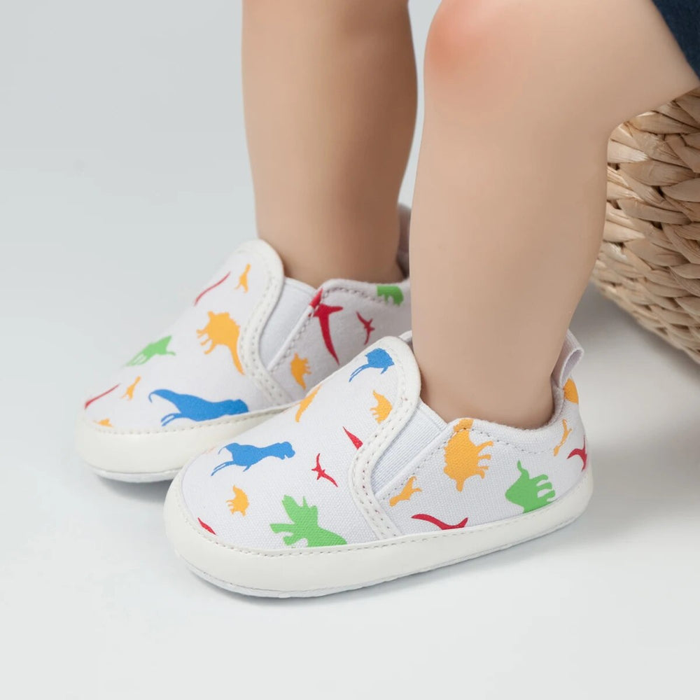 Slip-on-babyskor med halkfri sula – Minoe instegssneakers med dinosaurie och enhörning (0–18 månader)
