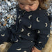 Byxdress/overall med manar – MoonDreamer Baby, unisex, svart, bomull, storlek 0–2 år