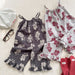 Lunea Kids Flora Volangbyxdress Flicka – Sommarjumpsuit i bomull – Blommönster – Volanger – 0–6 år – Luftiga barnkläder