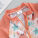 SunnySplash Badset för Barn | T-shirt, Shorts & Solhatt | UV-skydd | Dinosaurie & Krabba | 0–3 år